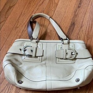 Pre-owned cream Coach bag.